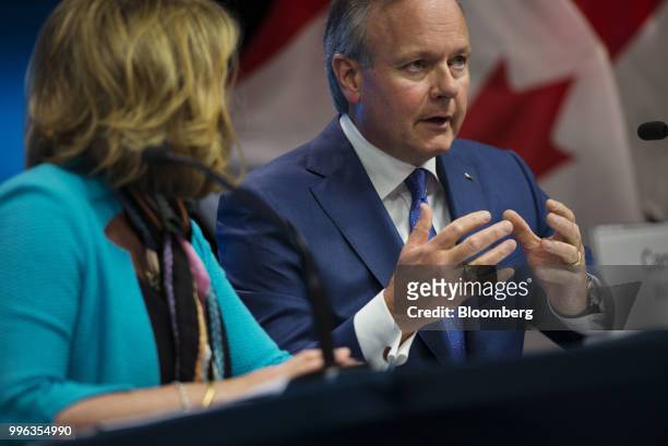 Stephen Poloz, governor of the Bank of Canada, right, speaks while Carolyn Wilkins, senior deputy governor at the Bank of Canada, listens during a...