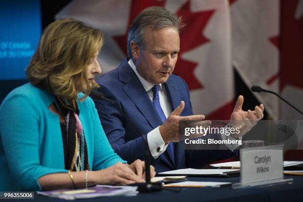 Stephen Poloz, governor of the Bank of Canada, right, speaks while Carolyn Wilkins, senior deputy governor at the Bank of Canada, listens during a...