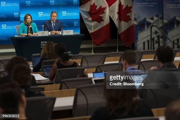 Stephen Poloz, governor of the Bank of Canada, right, and Carolyn Wilkins, senior deputy governor at the Bank of Canada, listen during a press...
