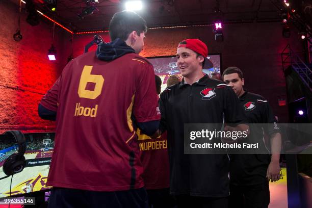 OneWildWalnut of Blazer5 Gaming and Hood of Cavs Legion Gaming Club shake hands after a game played on June 30, 2018 at the NBA 2K Studio in Long...
