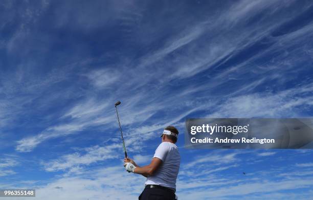 Ian Poulter of England is pictured wearing an England football shirt during the Pro Am event prior to the start of the Aberdeen Standard Investments...