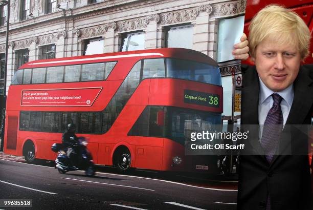 Mayor of London Boris Johnson poses with artists impressions of the design for London's new Routemaster bus on May 17, 2010 in London, England. The...