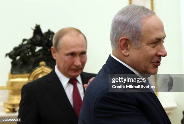 Russian President Vladimir Putin looks on Israeli Prime Minister Benjamin Netanyahu during their talks at the Kremlin, in Moscow, Russia, July 2018....