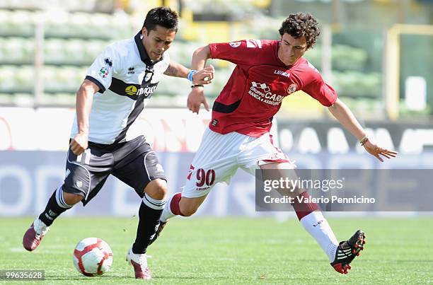 Luis Antonio Jimenez of Parma FC is challenged by Luca Simeoni of AS Livorno Calcio during the Serie A match between Parma FC and AS Livorno Calcio...