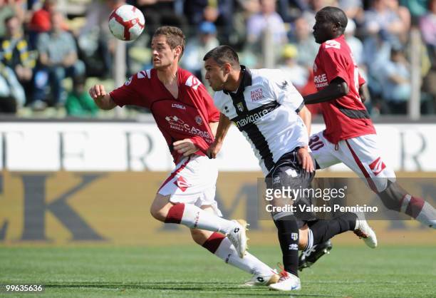 Emilov Valeri Bojinov of Parma FC battles for the ball with Jurgen Prutsch and Welle Ossou of AS Livorno Calcio during the Serie A match between...
