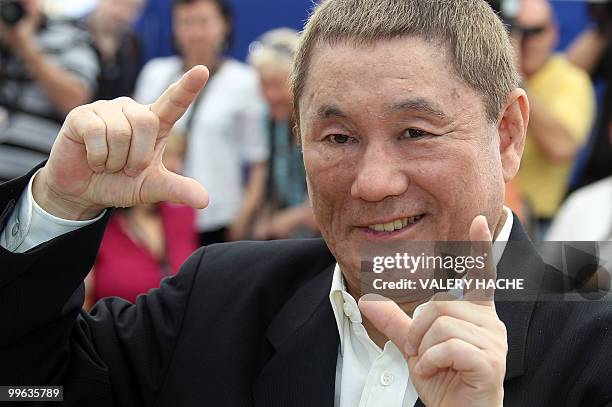 Japanese actor and director Takeshi Kitano poses during the photocall of "Outrage" presented in competition at the 63rd Cannes Film Festival on May...