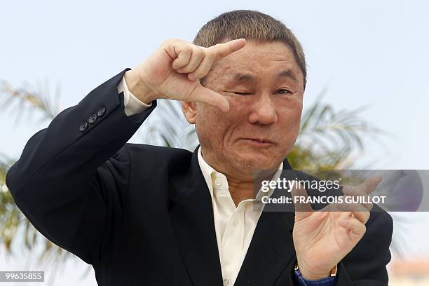 Japanese actor and director Takeshi Kitano poses during the photocall of "Outrage" presented in competition at the 63rd Cannes Film Festival on May...