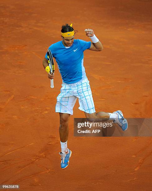 Spain's Rafael Nadal celebrates winning a point against Roger Federer during their final match of the Madrid Masters on May 16, 2010 at the Caja...