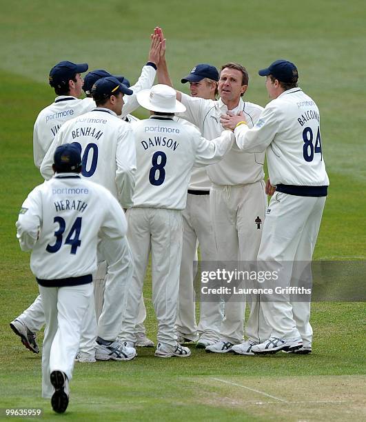 Dominic Cork of Hampshire is congratulated on the wicket of Samit Patel of Nottinghamshire during the LV County Championship match between...