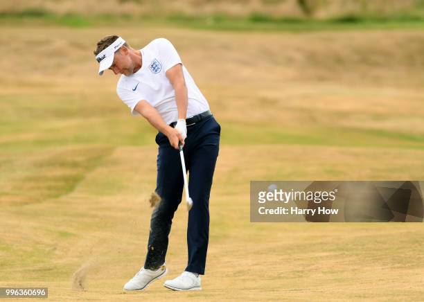 Ian Poulter of England hits a second shot on the 18th hole during the Pro-Am event of the Aberdeen Standard Investments Scottish Open at Gullane Golf...