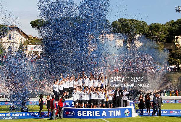 Inter Milan's team celebrate with the trophy during the ceremony of the Italian Serie A title on May 16, 2010 in Siena. Inter Milan secured a fifth...