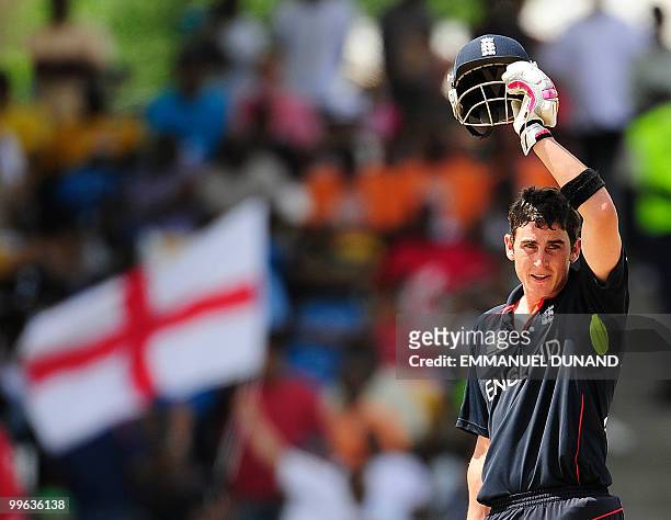 English batsman Craig Kieswetter removes his helmet after hitting a boundary during the Men's ICC World Twenty20 final match between Australia and...