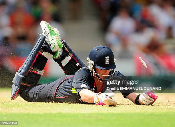 English batsman Craig Kieswetter dives back to safety during the Men's ICC World Twenty20 final match between Australia and England at the Kensington...