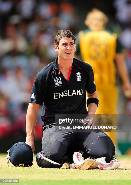 English batsman Craig Kieswetter smiles after diving back to safety during the Men's ICC World Twenty20 final match between Australia and England at...