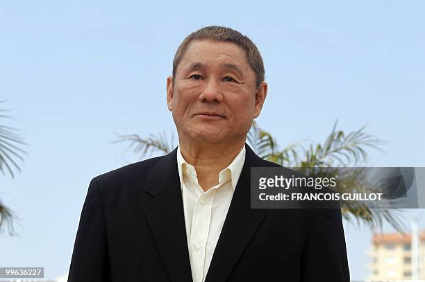Japanese actor and director Takeshi Kitano poses during the photocall of "Outrage" presented in competition at the 63rd Cannes Film Festival on May...