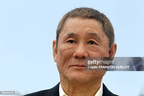 Japanese actor and director Takeshi Kitano poses during the photocall of "Outrage" presented in competition at the 63rd Cannes Film Festival on May...