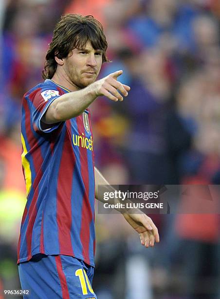 Barcelona's Argentinian forward Lionel Messi celebrates after scoring during the Spanish League football match between Barcelona and Valladolid, on...