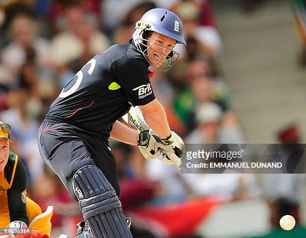 English batsman Eoin Morgan plays a shot past Australian wicketkeeper Brad Haddin during the Men's ICC World Twenty20 final match between Australia...