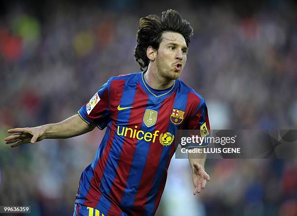 Barcelona's Argentinian forward Lionel Messi celebrates after scoring his team's fourth goal during the Spanish League football match between...