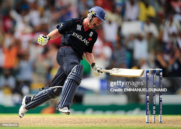 English batsman Eoin Morgan celebrates as England won the Men's ICC World Twenty20 final match between Australia and England at the Kensington Oval...