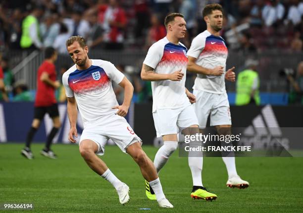 England's forward Harry Kane , England's defender Phil Jones and England's defender Gary Cahill warm up ahead of the Russia 2018 World Cup semi-final...