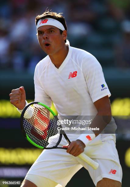 Milos Raonic of Canada celebrates winning the first set against John Isner of the United States during their Men's Singles Quarter-Finals match on...