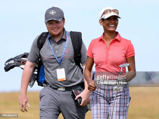 Television presenter Naga Munchetty smiles after a birdie on the ninth green during the Pro-Am event of the Aberdeen Standard Investments Scottish...