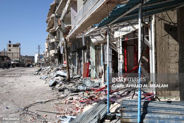 This general view taken on July 11 shows buildings destroyed during airstrikes by Syrian regime forces in the rebel-held town of Nawa, about 30...
