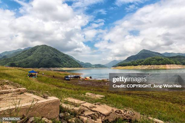 the lake with ruined structures in drought season - jong won heo stock-fotos und bilder