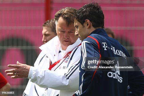 Louis van Gaal, head coach of Bayern Muenchen, talks to his player Mark van Bommel during the Bayern Muenchen training session at Bayern's training...