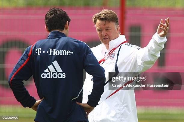 Louis van Gaal, head coach of Bayern Muenchen, talks to his player Mark van Bommel during the Bayern Muenchen training session at Bayern's training...