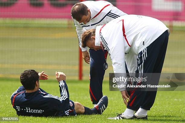 Louis van Gaal , head coach of Bayern Muenchen, talks to his player Mark van Bommel during the Bayern Muenchen training session at Bayern's training...