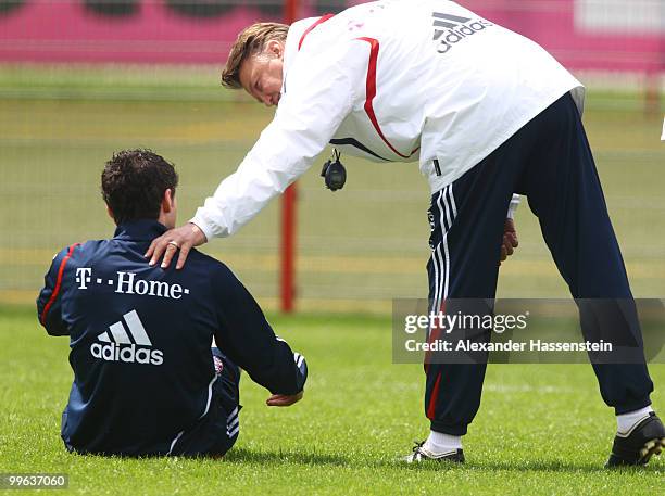 Louis van Gaal, head coach of Bayern Muenchen, talks to his player Mark van Bommel during the Bayern Muenchen training session at Bayern's training...