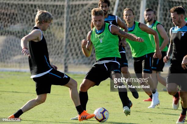Ciro Immobile and Dusan Basta of SS Lazio in action during the SS Lazio training session on July 11, 2018 in Rome, Italy.