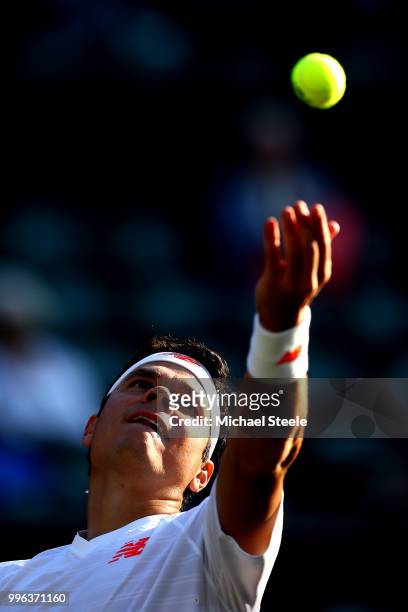 Milos Raonic of Canada serves against John Isner of the United States during their Men's Singles Quarter-Finals match on day nine of the Wimbledon...