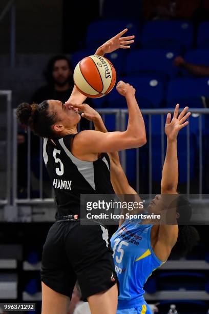 Las Vegas Aces forward Dearica Hamby shoots the ball against Chicago Sky forward Gabby Williams on July 10, 2018 at the Wintrust Arena in Chicago,...