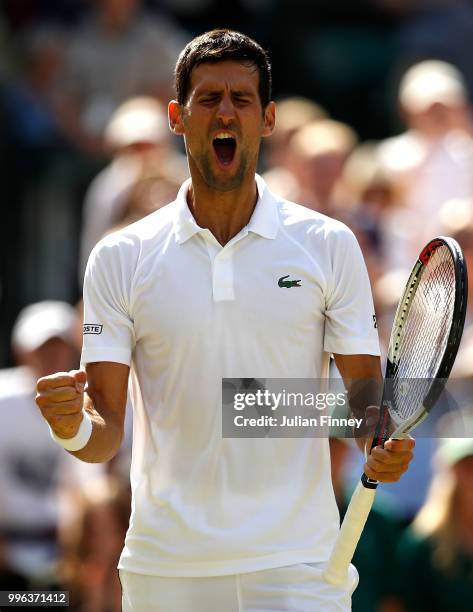 Novak Djokovic of Serbia celebrates winning match point against Kei Nishikori of Japan during their Men's Singles Quarter-Finals match on day nine of...