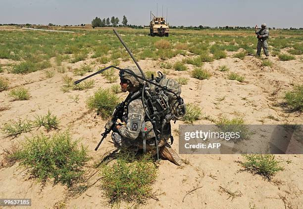 Soldiers from Bravo Troop 1-71 CAV patrol in Belanday village, Dand district in Kandahar on May 17, 2010. NATO and the United States are deploying...