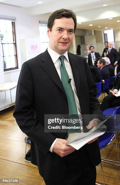 George Osborne, U.K. Chancellor of the exchequer, leaves after speaking at a press conference at H.M.Treasury in London, U.K., on Monday, May 17,...