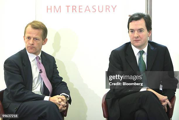 David Laws, U.K. Chief treasury secretary, left, sits with George Osborne, U.K. Chancellor of the exchequer, during a press conference at...