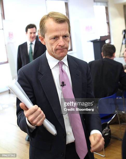 David Laws, U.K. Chief treasury secretary, leaves after speaking at a press conference at H.M.Treasury in London, U.K., on Monday, May 17, 2010. U.K....