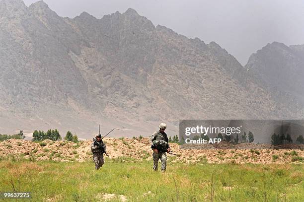 Soldiers from Bravo Troop 1-71 CAV patrol in Belanday village, Dand district in Kandahar on May 17, 2010. NATO and the United States are deploying...