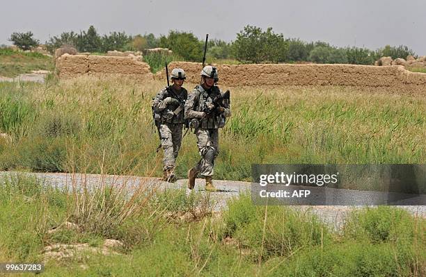 Soldiers from Bravo Troop 1-71 CAV patrol in Belanday village, Dand district in Kandahar on May 17, 2010. NATO and the United States are deploying...