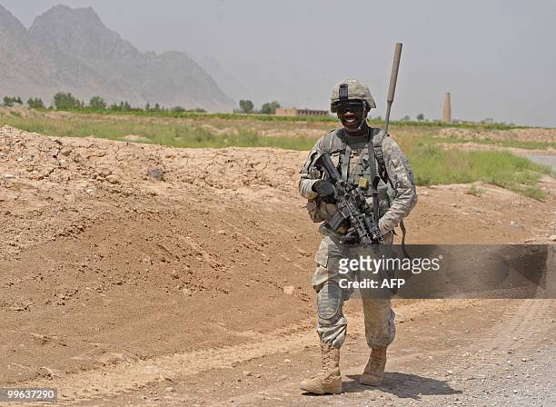 Soldier from Bravo Troop 1-71 CAV patrols in Belanday village, Dand district in Kandahar on May 17, 2010. NATO and the United States are deploying...