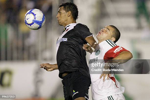 Elton of Vasco fights for the ball with Mauricio Ramos of Palmeiras during a match as part of Brazilian Championship at Sao Januario Stadium on May...