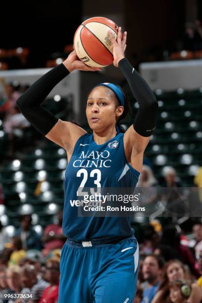 Maya Moore of the Minnesota Lynx handles the ball against the Indiana Fever on July 11, 2018 at Bankers Life Fieldhouse in Indianapolis, Indiana....