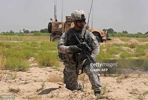 Soldier from Bravo Troop 1-71 CAV keeps watch during a patrol in Belanday village, Dand district in Kandahar on May 17, 2010. NATO and the United...