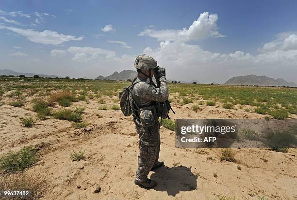 Soldier Cpt Jonathan Villasenor from Bravo Troop 1-71 CAV patrols in Belanday village, Dand district in Kandahar on May 17, 2010. NATO and the United...