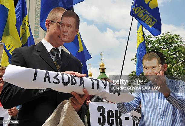 Activists of nationalist party Svoboda protest against the visit of Dmitry Medvedev in Kiev on May 17, 2010. Activists wearing paper masks of...