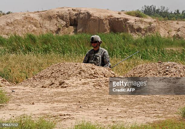 Soldier 1LT Joseph Theinert from Bravo Troop 1-71 CAV patrols in Belanday village, Dand district in Kandahar on May 17, 2010. NATO and the United...